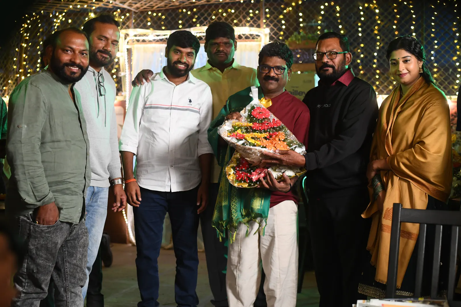 Lyricist Chandrabose being felicitated with a bouquet at the DNV song launch